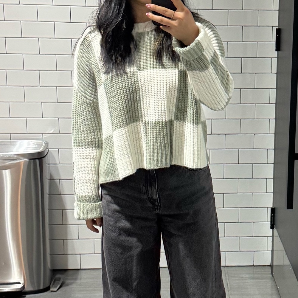 Green and white checkered sweater